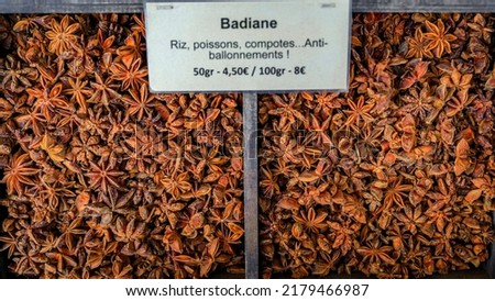 Star anise with a sign suggesting use for rice, fish, compote and bloating at a local farmers market Cours Saleya in Old Town Nice, South of France