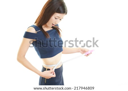 Woman measuring her stomach