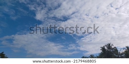 Shattered clouds cover the blue sky over Yogyakarta, Indonesia
