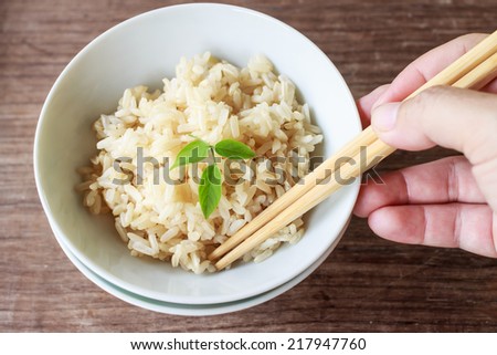 steam brown rice serve on china cup