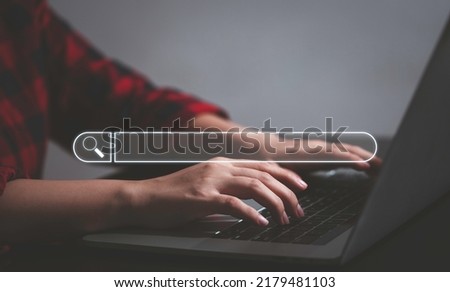 Data Search Technology google search or SEO Search Engine Optimization concept. Woman's hands typing on laptop computer keyboard surfing the internet to search for information on web browser. Royalty-Free Stock Photo #2179481103