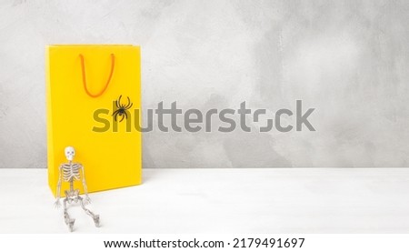 Shopping bags and holiday Halloween decor with copy space, holiday sale mockup.