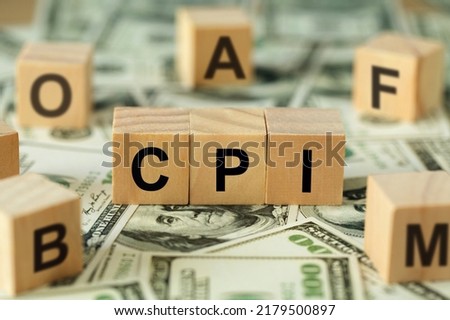 CPI word consumer price index symbol On Wooden blocks on top of the dollar bills on the table. Business and CPI, consumer price index concept. Royalty-Free Stock Photo #2179500897