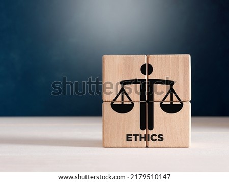 Business ethics or justice symbol on wooden cubes. Ethical corporate culture, business integrity and moral principles concept. Royalty-Free Stock Photo #2179510147