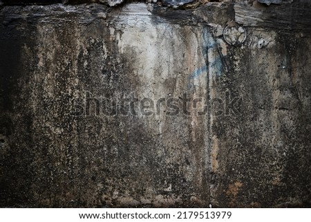 A close up picture of a grungy textured deteriorating wall