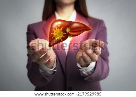 Woman and illustration of unhealthy liver on light grey background. Viral hepatitis Royalty-Free Stock Photo #2179529985