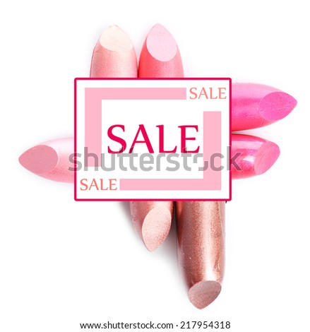 Sale concept. Several different lipsticks isolated on white