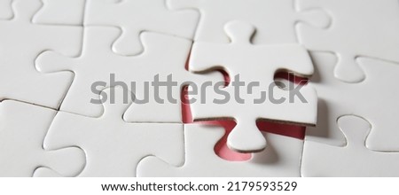 Jigsaw puzzle on table, closeup Royalty-Free Stock Photo #2179593529