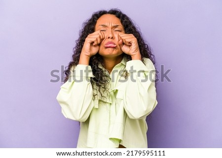 Young hispanic woman isolated on purple background whining and crying disconsolately. Royalty-Free Stock Photo #2179595111