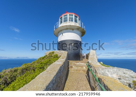 Cape Point is located near the city of Cape Town, South Africa. The peninsula has towering rock cliffs and lighthouse that overlook the beautiful ocean view. A tourism and travel hot spot.