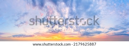 Majestic sunrise sundown sky background with gentle colorful clouds without birds. Panoramic, big size Royalty-Free Stock Photo #2179625887