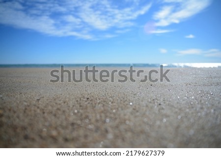 a view of the horizon from the beach at ground level Royalty-Free Stock Photo #2179627379