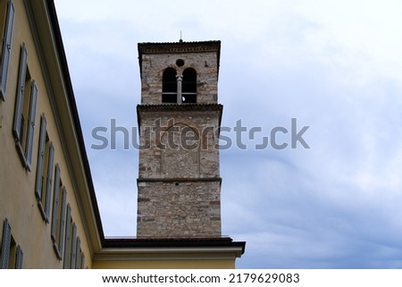 Church tower of church Santa Maria degli Angioli on a cloudy summer day. Photo taken July 4th, 2022, Lugano, Switzerland.