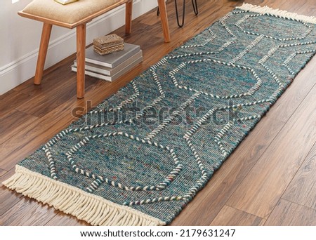 Hand woven trellis wool area rug. Royalty-Free Stock Photo #2179631247
