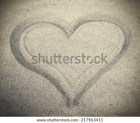 Picture of heart drew on white sand