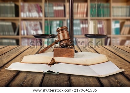 Legal office of lawyers, justice and law concept, scale of justice on a desk in a courtroom, Royalty-Free Stock Photo #2179641535