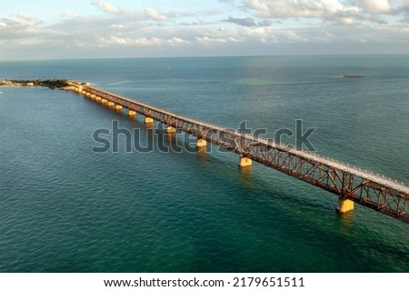 Aerial view of a historic railroad bridge spanning the channel between Bahia Honda key and Big Pine Key in Florida. Royalty-Free Stock Photo #2179651511