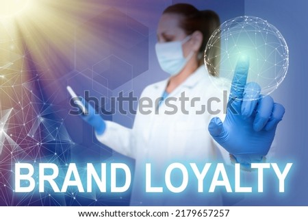 Text caption presenting Brand Loyalty. Conceptual photo Repeat Purchase Ambassador Patronage Favorite Trusted Nurse in uniform pointing upwards represents global innovative thinking.