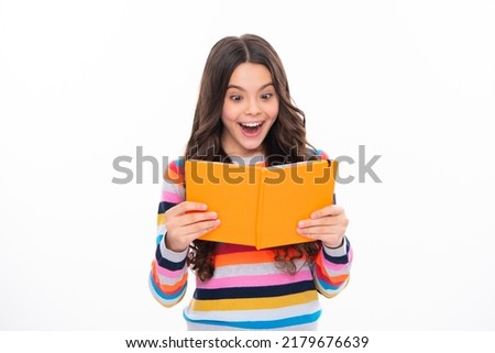 School child with book. Learning and education. Excited face, cheerful emotions of schoolgirl.