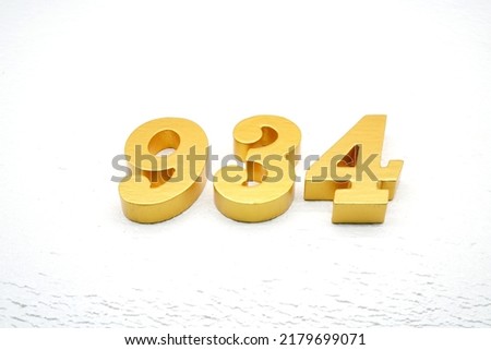    Number 934 is made of gold painted teak, 1 cm thick, laid on a white painted aerated brick floor, visualized in 3D.                                
