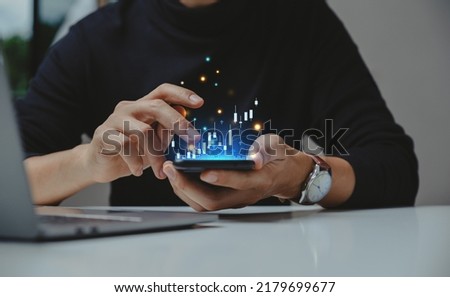 Financial and business investment concept. Businessman using smartphone analyze investment in stock market. growth graph chart on screen.  Royalty-Free Stock Photo #2179699677