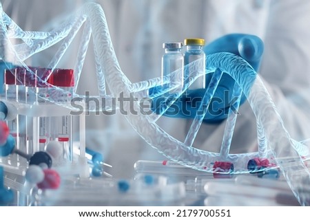 Scientist with tube and virtual screen with data scientific at genetic engineering lab. Biomedical engineer genetic working with tubes in biotechnical laboratory Royalty-Free Stock Photo #2179700551
