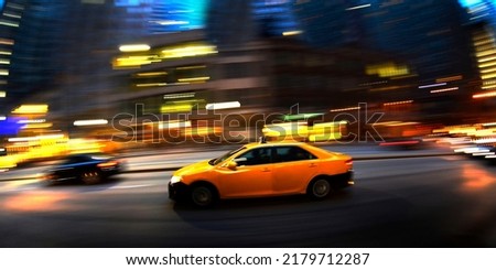 Taxi at night in busy city Chicago on street driving fast transportation