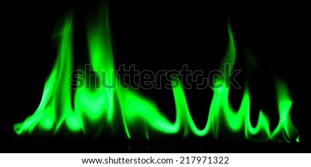 Green fire and flames on a black background.
