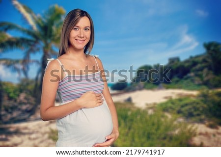 Pregnant woman on the beach happy mood. Happy pregnant woman Walking on beach.