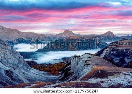 Incredible panoramical view in the foggy morning Dolomites mountains. Location Auronzo rifugio in Tre Cime di Lavaredo National Park, Dolomites, Trentino Alto Adige, Italy Royalty-Free Stock Photo #2179758247