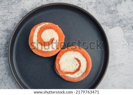 Salmon roll with mozzarella. Semi-finished dish Royalty-Free Stock Photo #2179763471