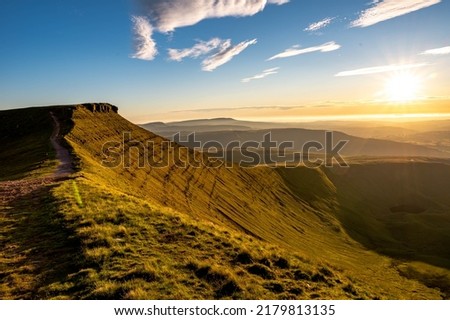 stunning sunset, golden hour at pen y fan brecon beacons south wales uk Royalty-Free Stock Photo #2179813135