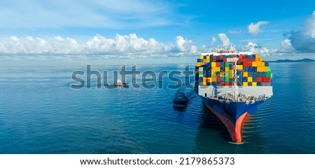 Front View contaier cargo ship import export container box on the ocean sea on blue sky back ground concept transportation logistic and service to customer and supply change Freight Forwarder 