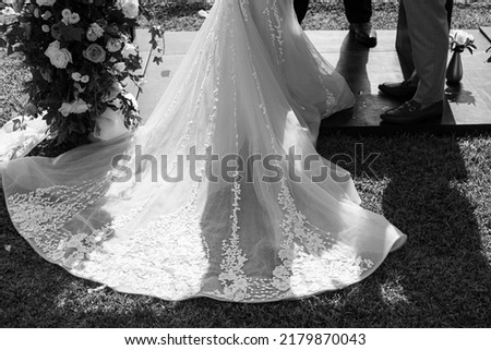 Close up of a wedding dress or bridal gown which is the dress worn by the bride during a wedding ceremony. Royalty-Free Stock Photo #2179870043