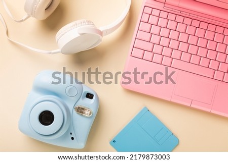 camera laptop headphones and floppy diskette in bright colors. High quality photo Royalty-Free Stock Photo #2179873003