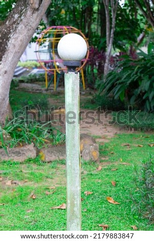 a garden lamp in a city park