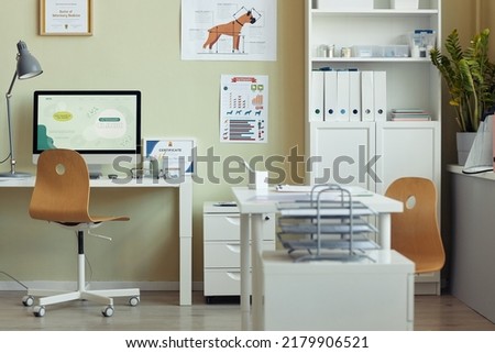 Background image of modern vet clinic interior, focus on workplace desk and certificates on wall, copy space