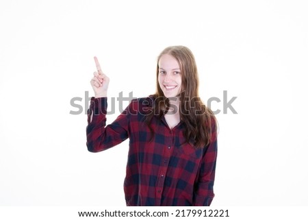 Young blonde pretty woman over isolated white background pointing up finger to present a product