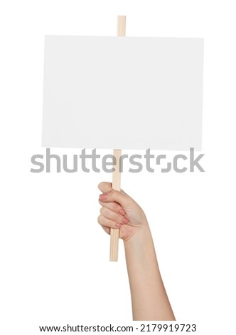 Woman holding blank protest sign on white background, closeup Royalty-Free Stock Photo #2179919723