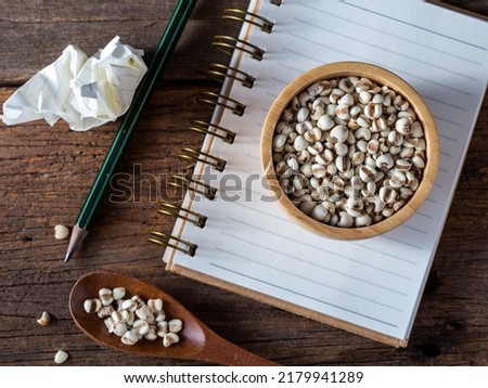 dried beans and nuts on wooden background
