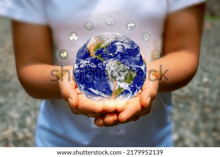 The world is held by human hands-on Earth Day concept (Earth Day) on April 22 of every year to save energy. (Elements of this image furnished by NASA)