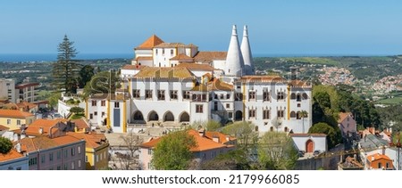 Sintra National Palace at sunny day in Sintra town, Portugal. National Palace, famous landmark of Sintra. Popular portuguese travel destination. Big panorama of the Sintra Palace Royalty-Free Stock Photo #2179966085