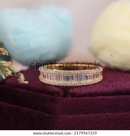 Photo of sparkly lady's ring on velvet Ring Box 