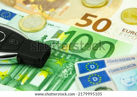 Finances and traffic with Euro and German driving licence Royalty-Free Stock Photo #2179995105