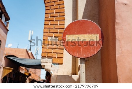 A no entry sign in a busy medina street