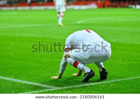 Footballer after missing shoot during soccer match. Royalty-Free Stock Photo #2180006161