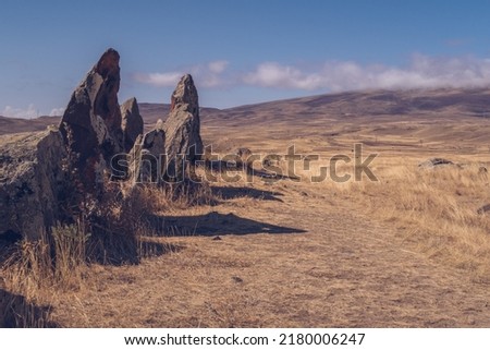 Megalithic standing stones and burial mound of Zorats Karer or Carahunge - prehistoric monument in Armenia. Armenian Stonehenge stock photo