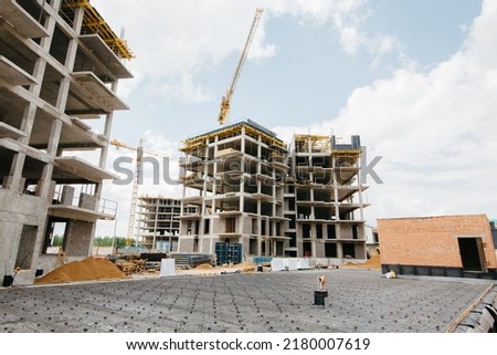 beautiful photo of the construction of stylish apartments against a blue sky
