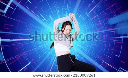 Asian female dancer dancing on stage. Royalty-Free Stock Photo #2180009261