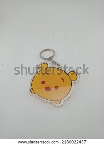 a keychain with a cute bear picture